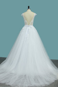 2024 Scoop Open Back Wedding Dresses Tulle With Applique A Line Chapel Train