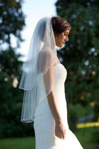https://www.rosepromdress.com/cdn/shop/products/White_Tulle_Wedding_Veils_Bride_Ribbon_Edge_Two_Tiers_Wedding_Veils_with_Comb_V01_320x.jpg?v=1569998047