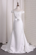 Load image into Gallery viewer, 2024 Satin Mermaid Off The Shoulder Wedding Dresses With Applique And Sash